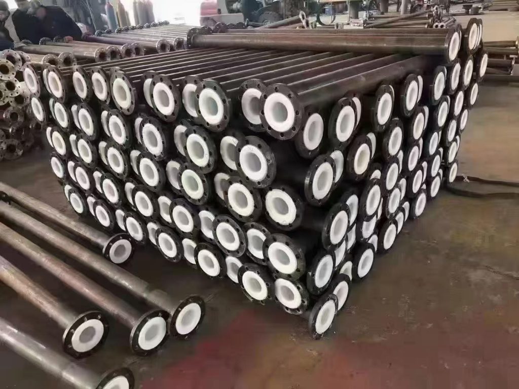 Lined steel pipe stock with flanged ends in the warehouse