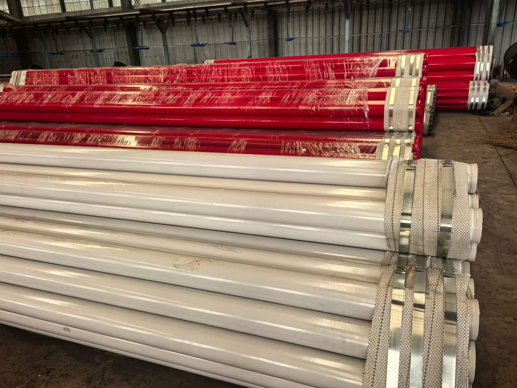 Bundles of lined pipe stacked and strapped ready for shipment